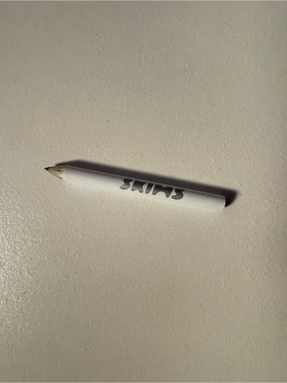 SKIMS compact white